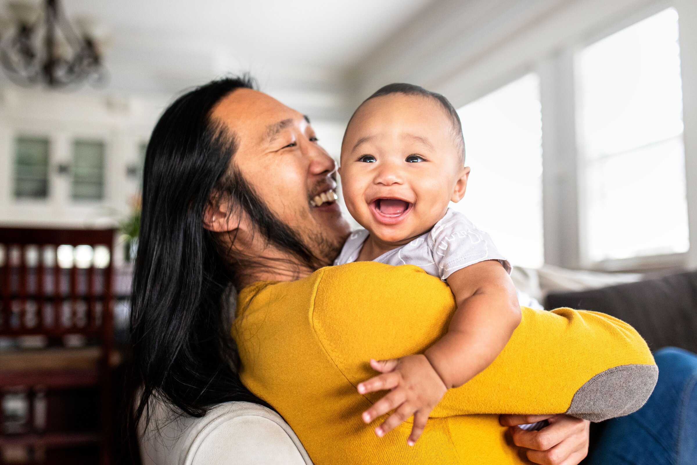 Happy Dad and Baby on Couch