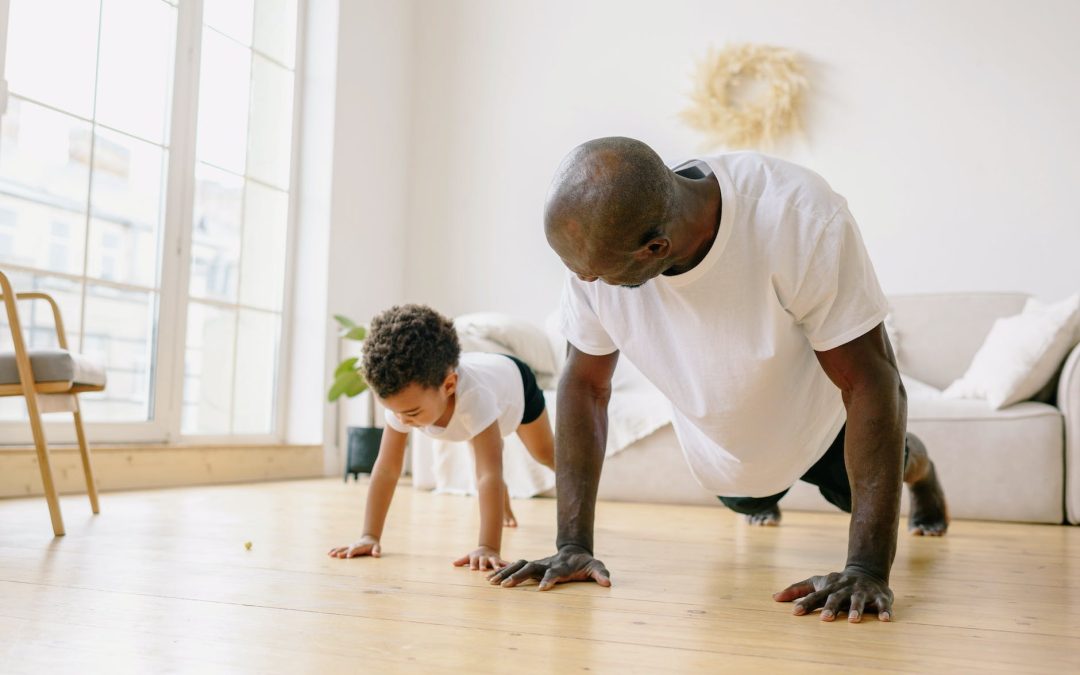 a father and son planking